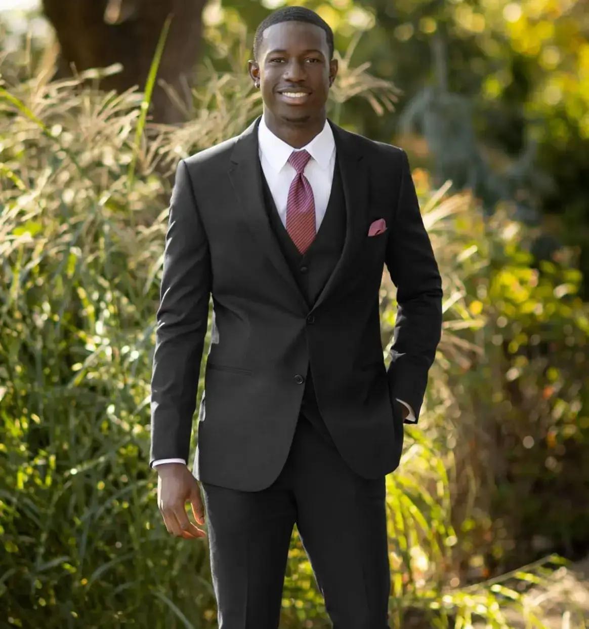 Model wearing a tuxedo suit